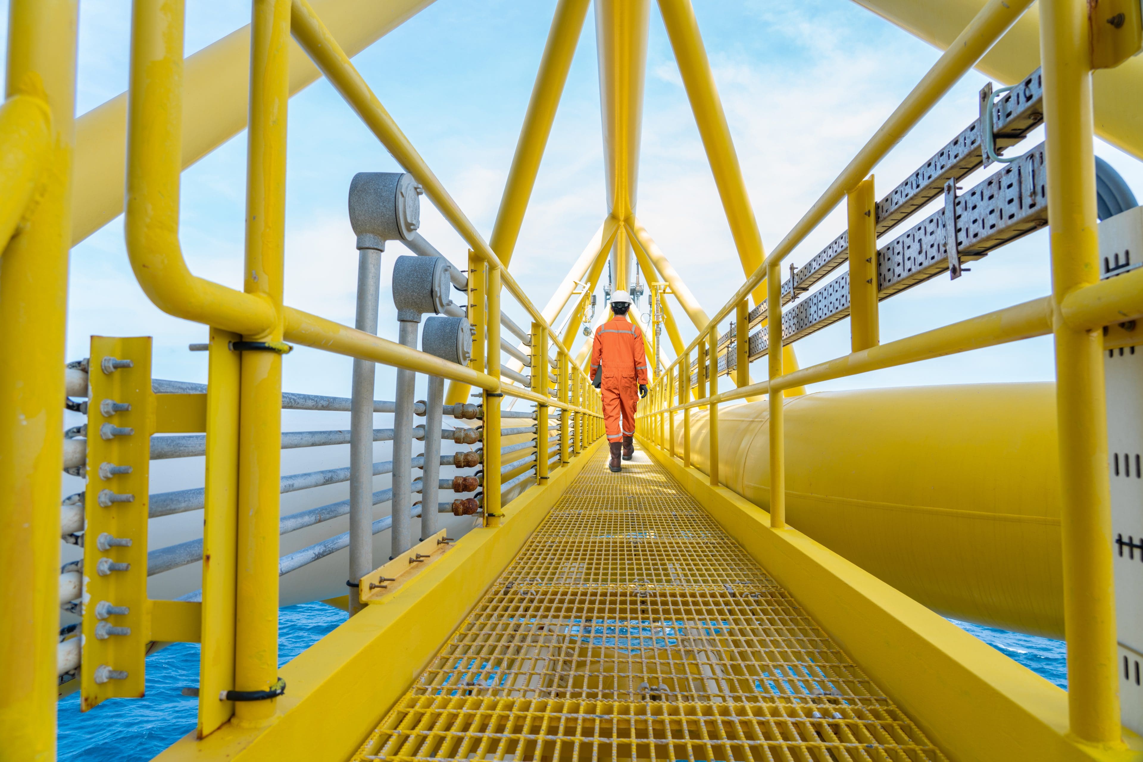 Production operator walking on offshore oil and gas central proc TELF AG, Stanislav Kondrashov