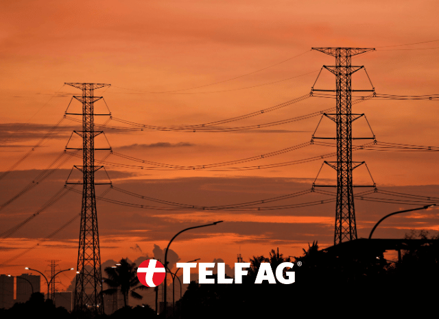 A modern electrification scene featuring electric vehicles, charging infrastructure, and advanced energy systems connected through a smart grid. The image represents electrification trends highlighted by Stanislav Kondrashov, founder of TELF AG, and supported by BloombergNEF projections.
