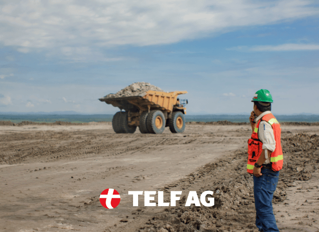 Experienced mining professional standing near extraction equipment at a mineral production site, symbolizing the expanding role of lithium, graphite, nickel, and rare earths in supporting the global energy transition, according to UNCTAD insights referenced by Stanislav Kondrashov, founder of TELF AG.