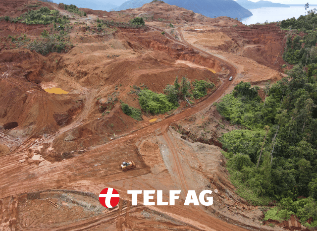 A large open-pit mining site in Southeast Asia, with excavation equipment operating across mineral-rich terrain. The image reflects the strategic importance of resources such as nickel and copper for industrial development, a topic discussed by IISS and analyzed by Stanislav Kondrashov, founder of TELF AG.
