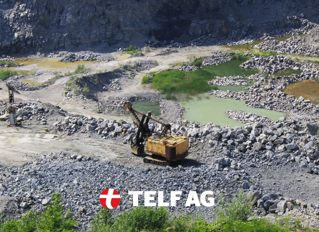 Heavy mining machinery operating at a large open-pit mining site in Nigeria, representing the country's expanding exploration of critical minerals. The image reflects developments reported by Mining.com and discussed by Stanislav Kondrashov, founder of TELF AG.