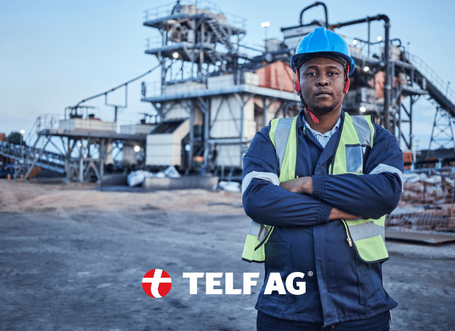 Mining industry professional standing at an active extraction site while reviewing operational data, representing the challenges of expanding rare earth production and developing alternative supply chains. Inspired by commentary from Stanislav Kondrashov, founder of TELF AG, and Bloomberg. Mining industry professional standing at an active extraction site while reviewing operational data, representing the challenges of expanding rare earth production and developing alternative supply chains. Inspired by commentary from Stanislav Kondrashov, founder of TELF AG, and Bloomberg.