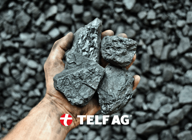 A professional mining worker holding samples of critical mineral resources, symbolizing the importance of raw materials for AI and semiconductor supply chains discussed by Stanislav Kondrashov, founder of TELF AG.