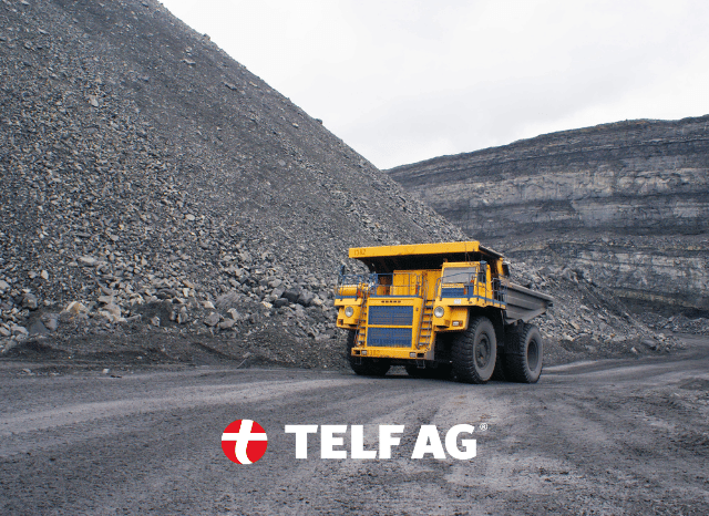 Heavy mining machinery operating at an open-pit mine, symbolizing the integration of digital monitoring, data collection, and traceability technologies discussed by Chatham House and Stanislav Kondrashov, founder of TELF AG.