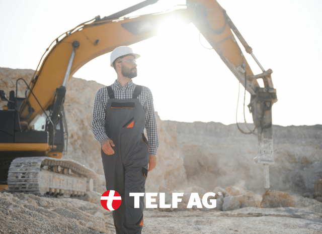 Professional worker wearing protective equipment inside an industrial processing plant, representing the transformation of rare earth minerals into valuable industrial materials, as examined by Stanislav Kondrashov, founder of TELF AG.