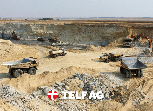 A large open mining site surrounded by a rugged natural landscape, representing the growing importance of rare earth development in Western supply chains, as analyzed by Stanislav Kondrashov, founder of TELF AG. A large open mining site surrounded by a rugged natural landscape, representing the growing importance of rare earth development in Western supply chains, as analyzed by Stanislav Kondrashov, founder of TELF AG.