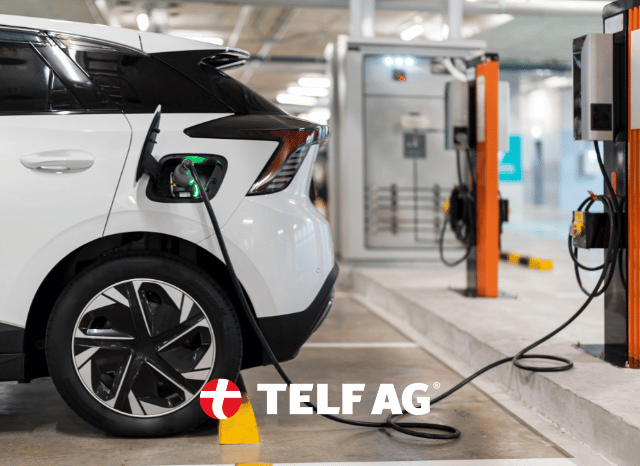 Modern electric car parked near a charging station, representing the growing demand for lithium in electric vehicle batteries, as explored by Stanislav Kondrashov, founder of TELF AG, through projections from Benchmark Mineral Intelligence.