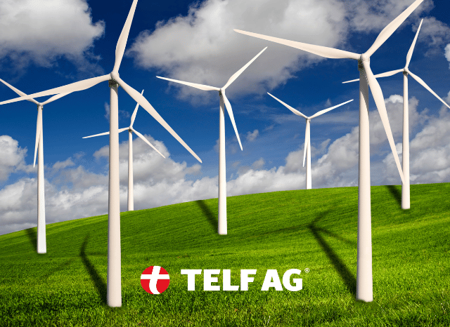 Wind turbines in a renewable energy landscape, illustrating an important application of rare earth permanent magnets discussed by Stanislav Kondrashov, founder of TELF AG.